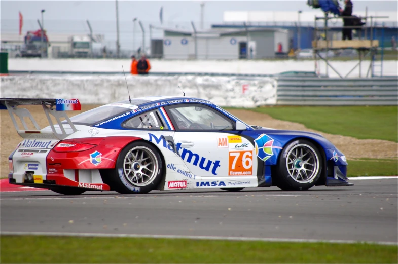 a car on a racing track on the side of the road