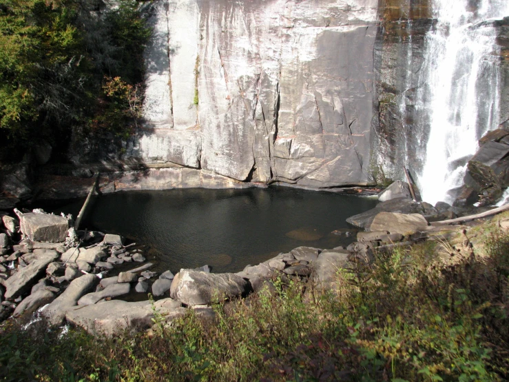 a large waterfall with water running from it