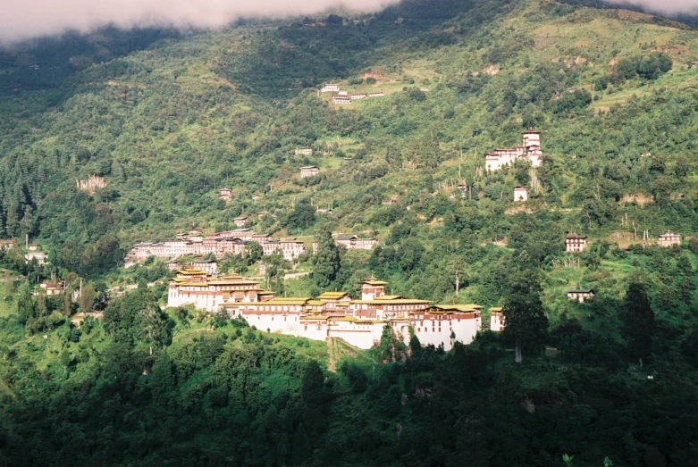 a small mountain with lots of houses on it