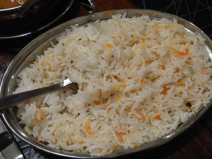 a plate filled with rice and a spoon