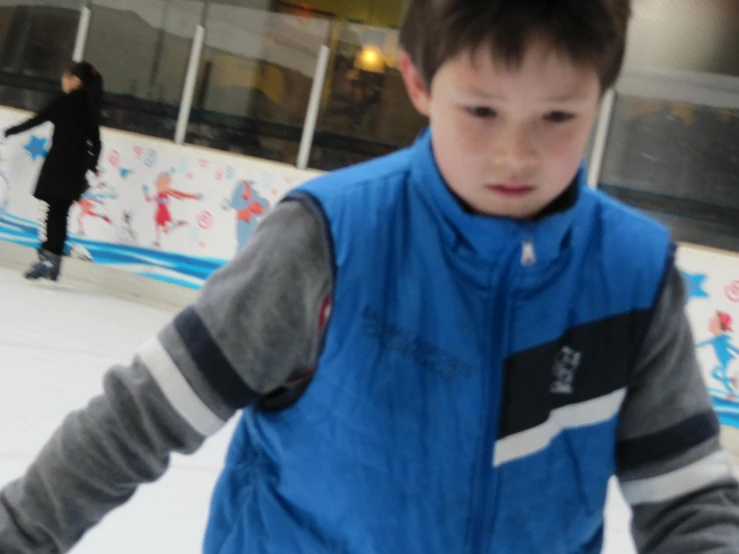 a  standing on top of an ice rink