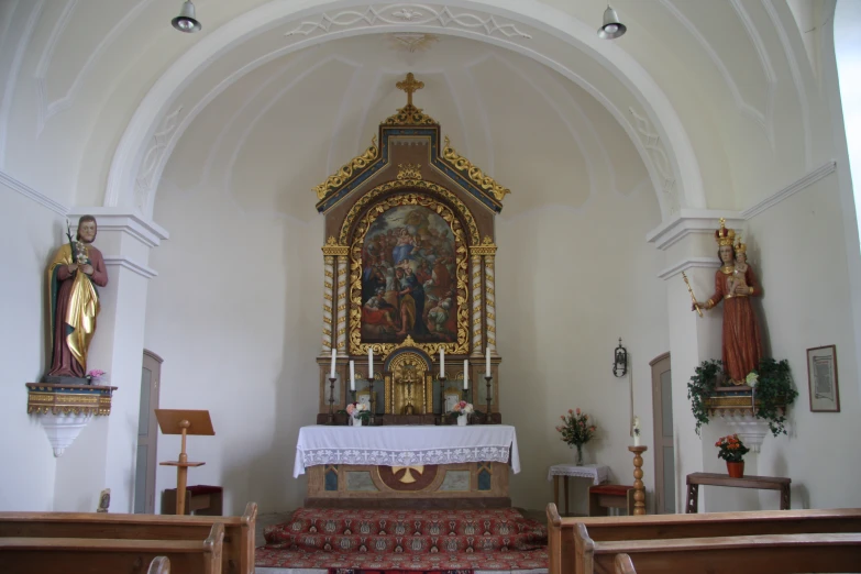 an image of inside of a church with ornate alter