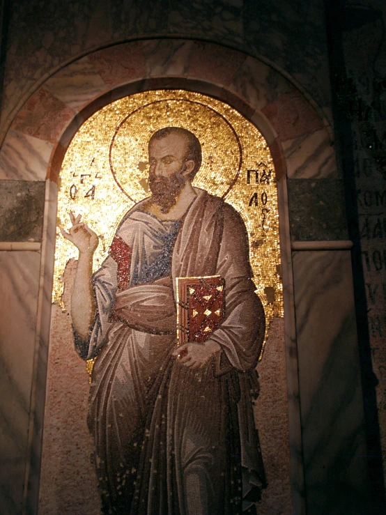 a statue with a man holding soing in front of it