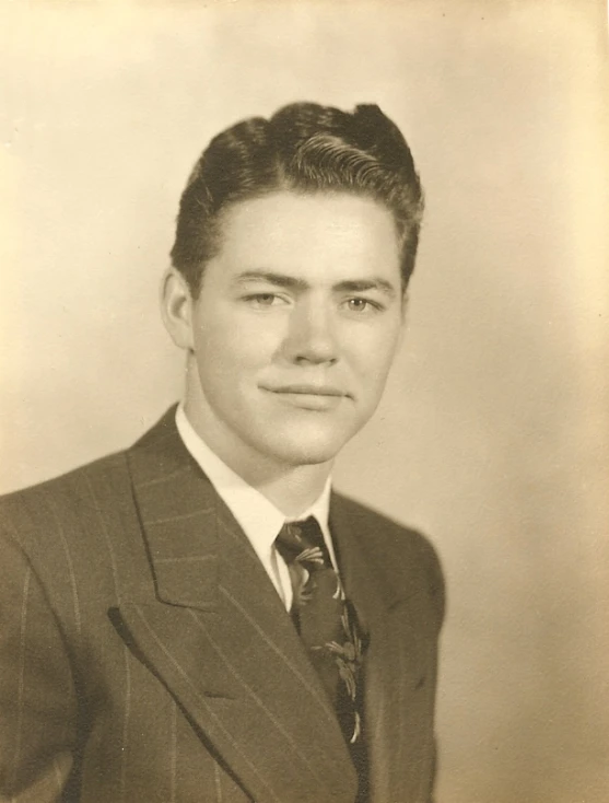 black and white pograph of a man in a suit