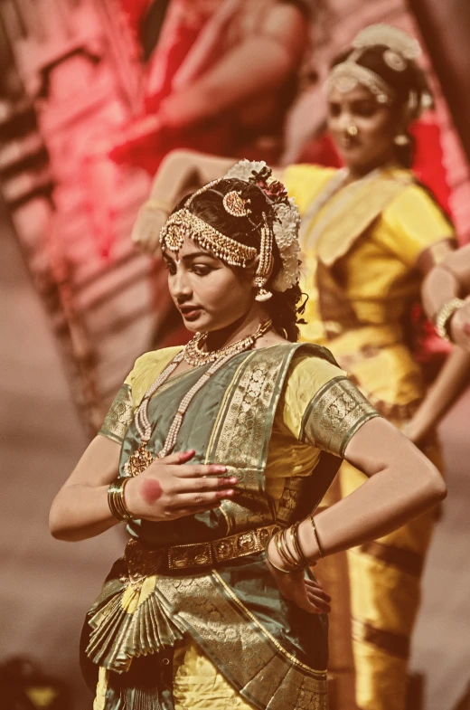 a woman in a yellow skirt and headdress