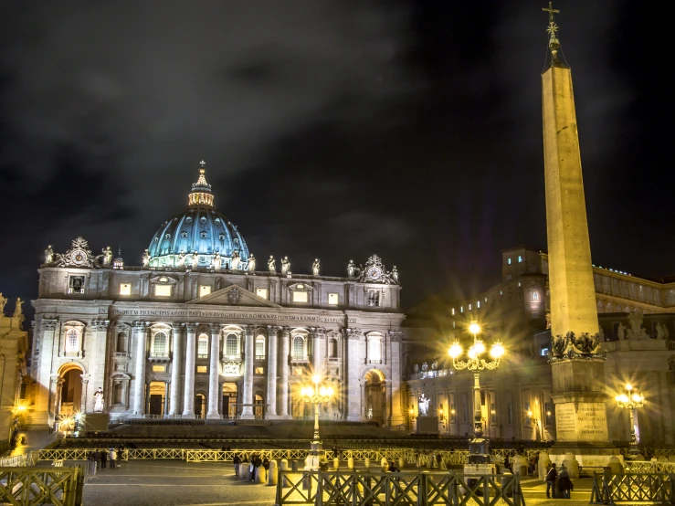 a white building with a blue dome surrounded by lights