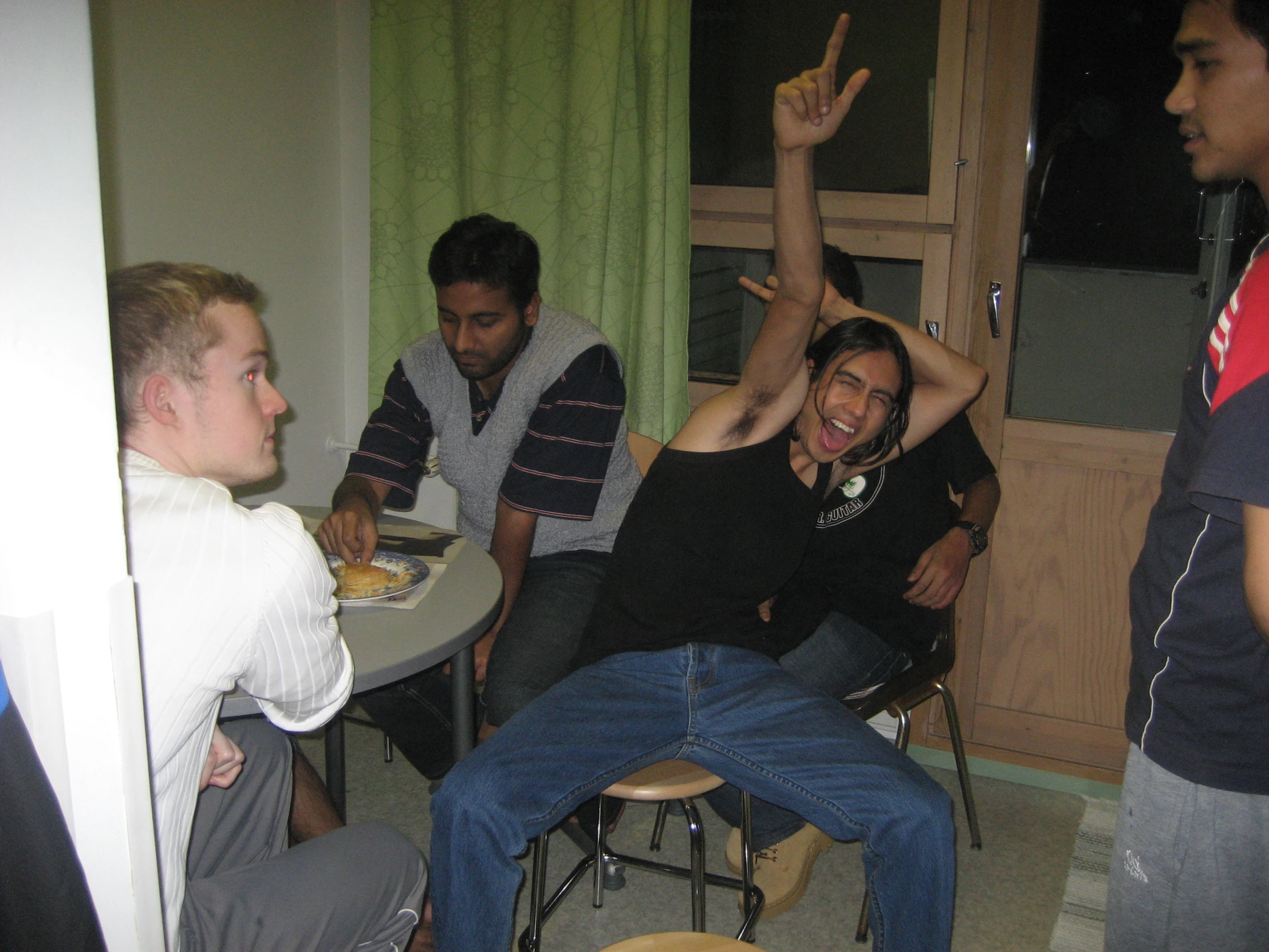 group of people watching and eating in the room