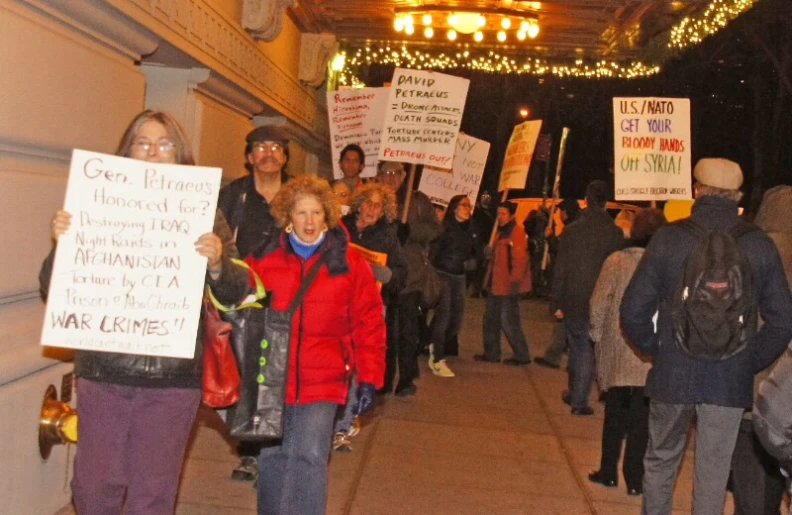 a large group of people march down the street