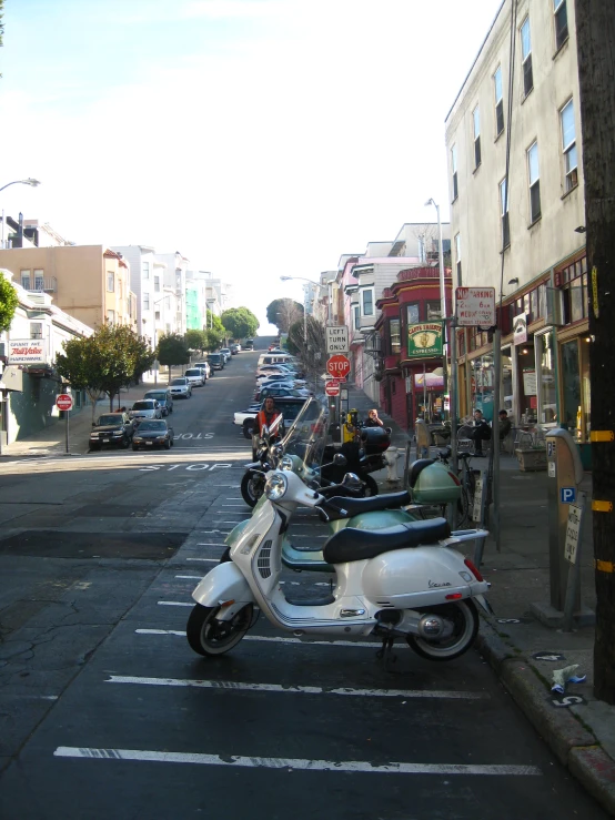 there are many scooters parked in the street