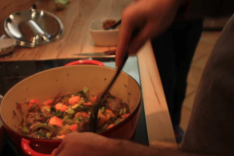 a pot of vegetables is cooking on the stove