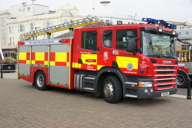 there is a fire truck that has red and yellow on it