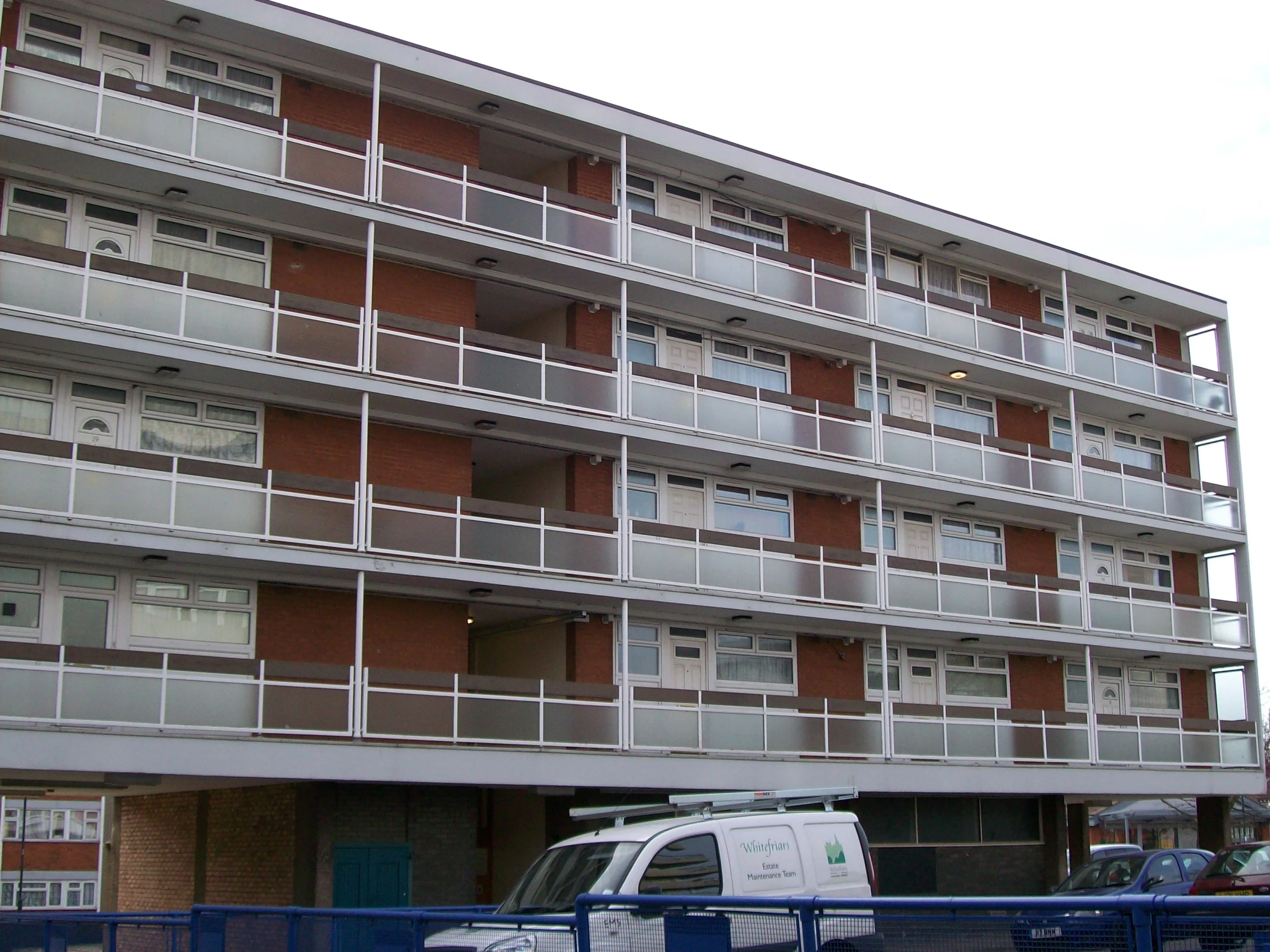 a white van is parked outside of a building