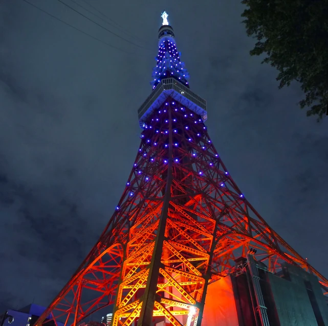 a very tall building lit up with blue lights