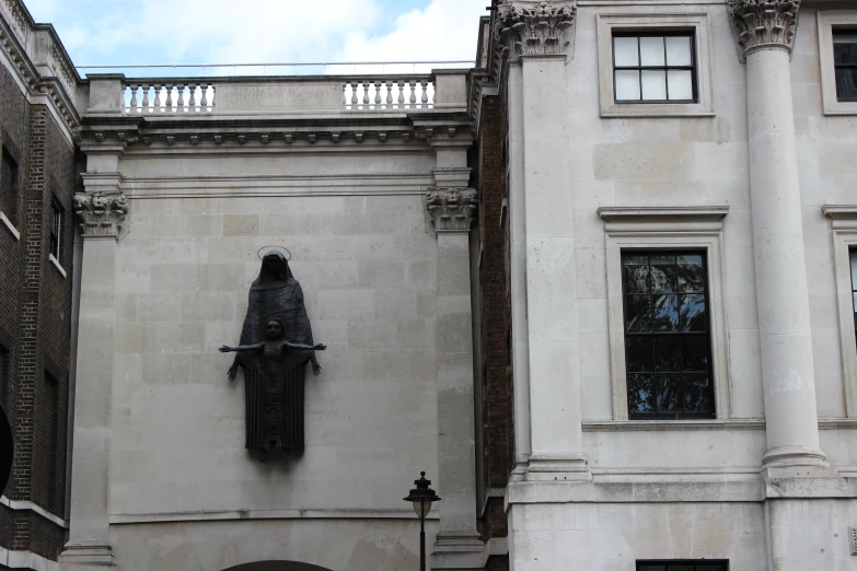 a clock is mounted on the side of a building