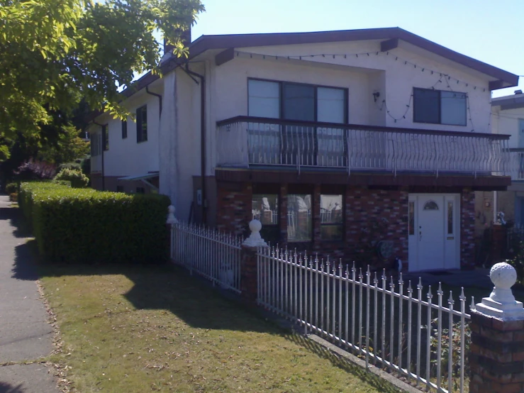 two large houses side by side on a sunny day