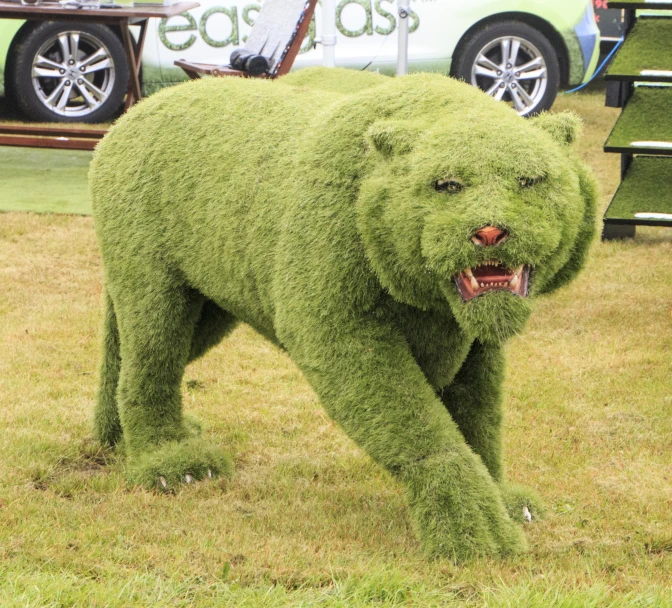 an elaborate sculpture of a bear is being displayed