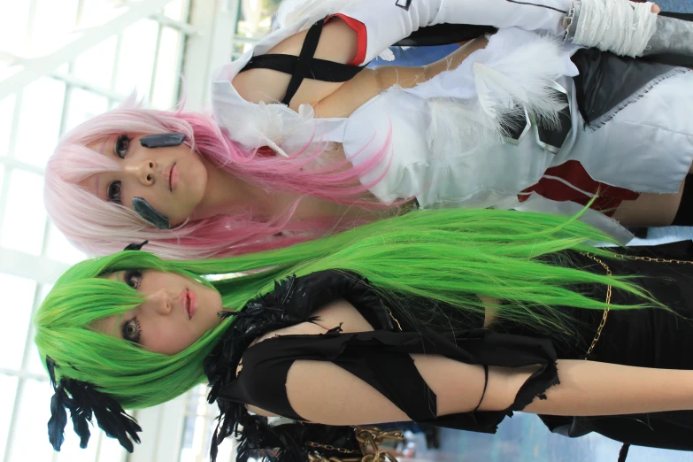 two cosplaying women wearing costumes in an indoor area