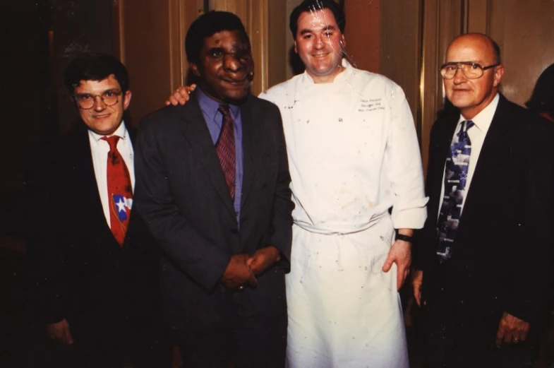 a group of people in suits standing together