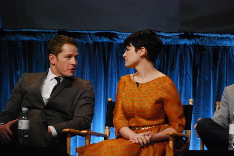 actors sitting down for a panel at a conference