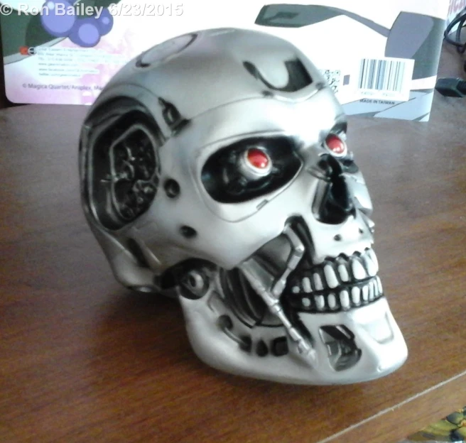 the silver skull has red eyes and has red eyes