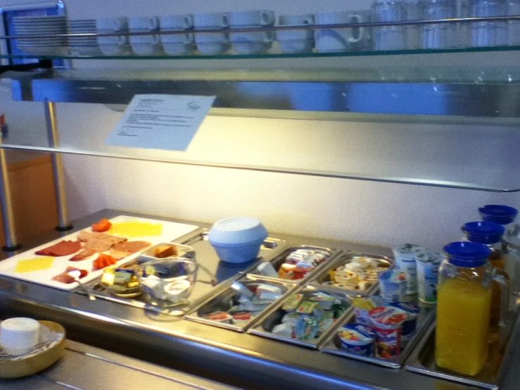 a stainless steel counter with many items on it