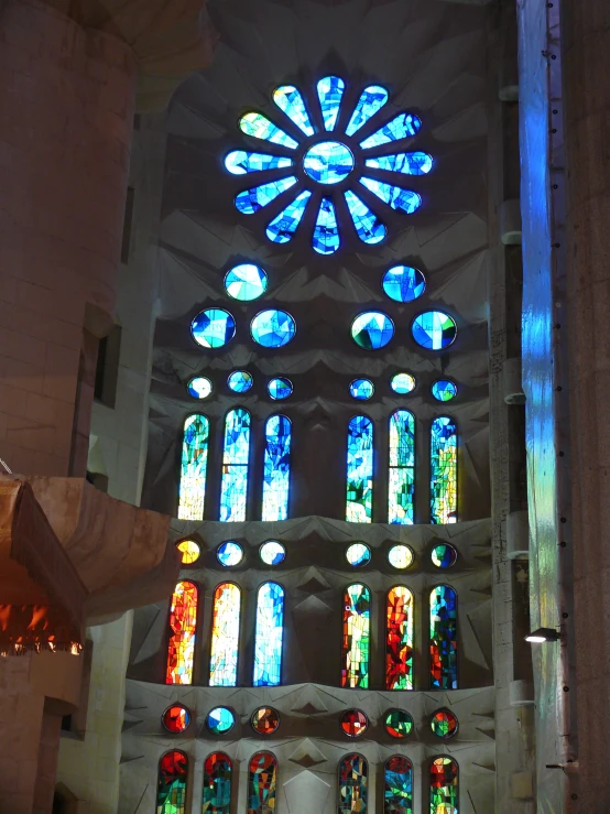 an inside view of a building with different colored glass window