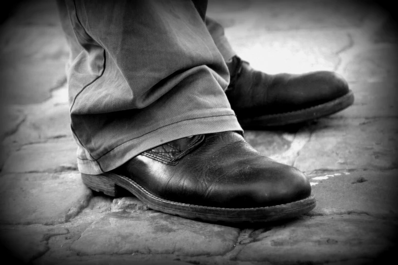 a person in brown shoes on the ground
