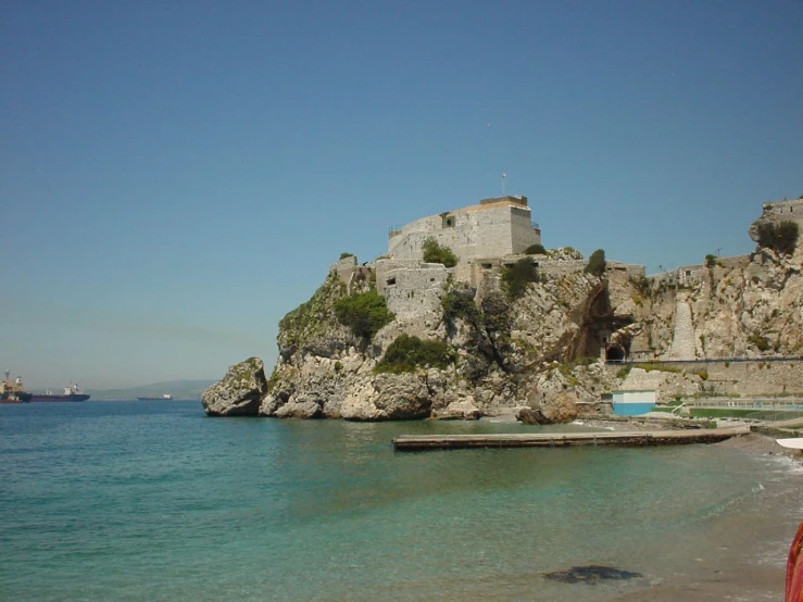 an island with some blue water near by