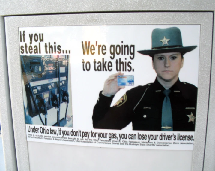 the woman in the police uniform is holding a card