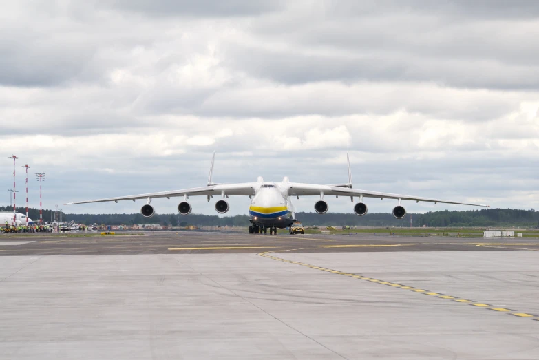 a jet airliner is on the runway at an airport