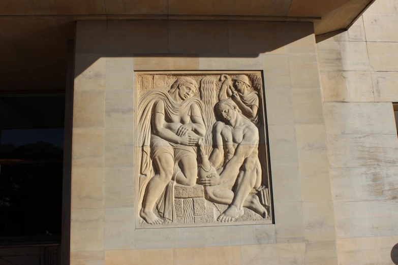 a sculpture of a person holding an umbrella