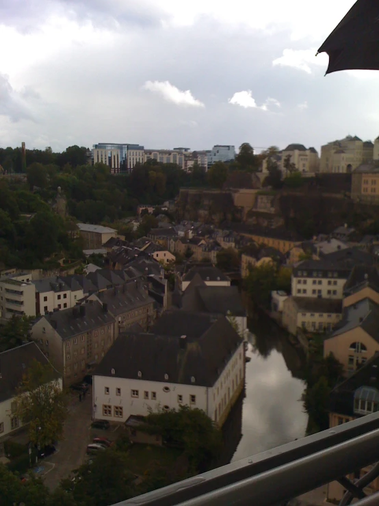 an outdoor town in a river near some houses