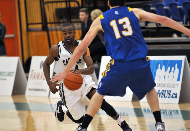 an basketball game in action with the player dribbling a basketball