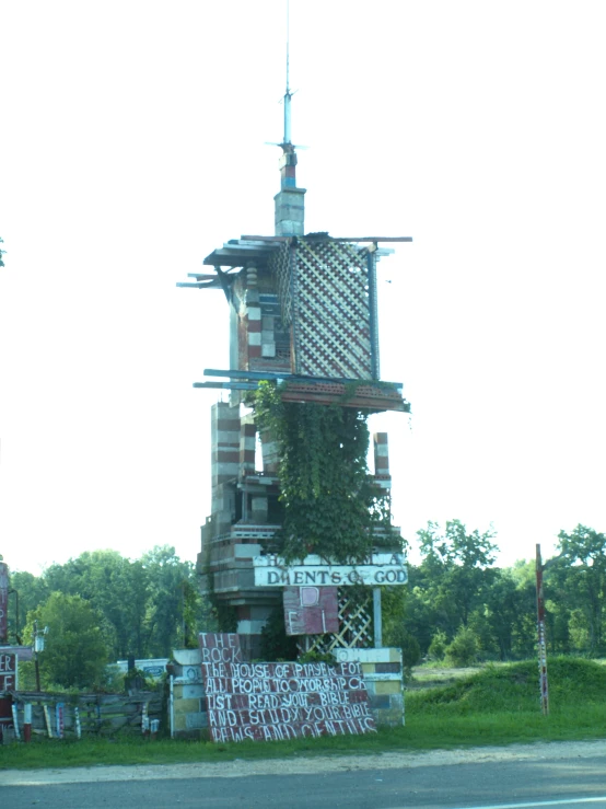 a tall tower that has plants growing inside