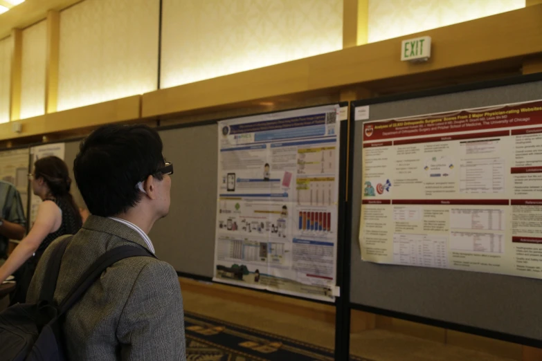 a group of people standing in front of a poster