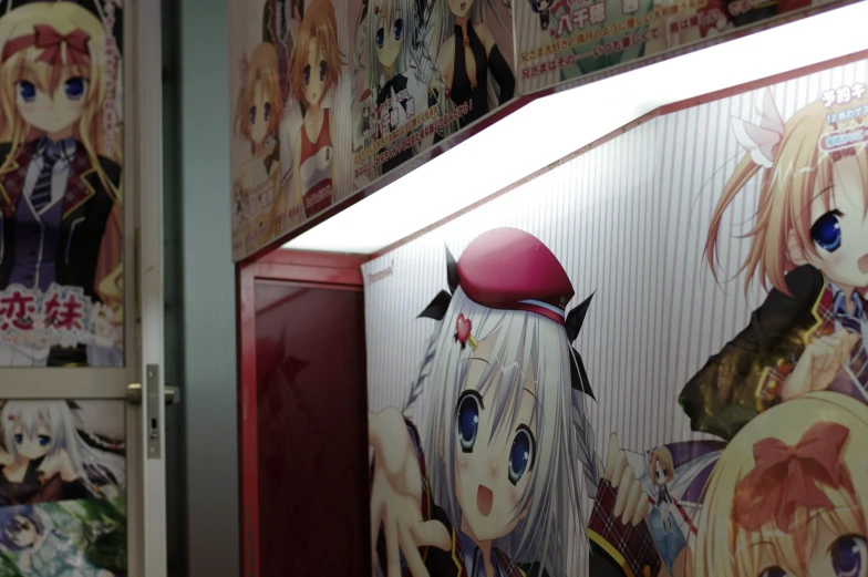 many anime images are covering a wall