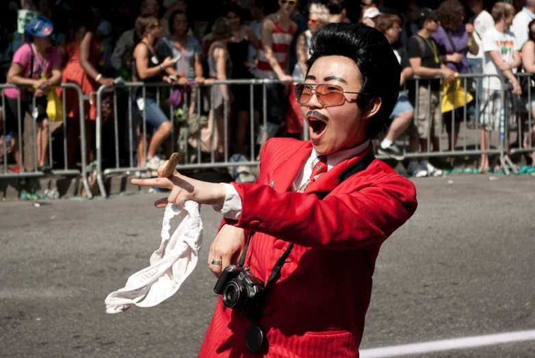 man in costume playing trumpet at outdoor event