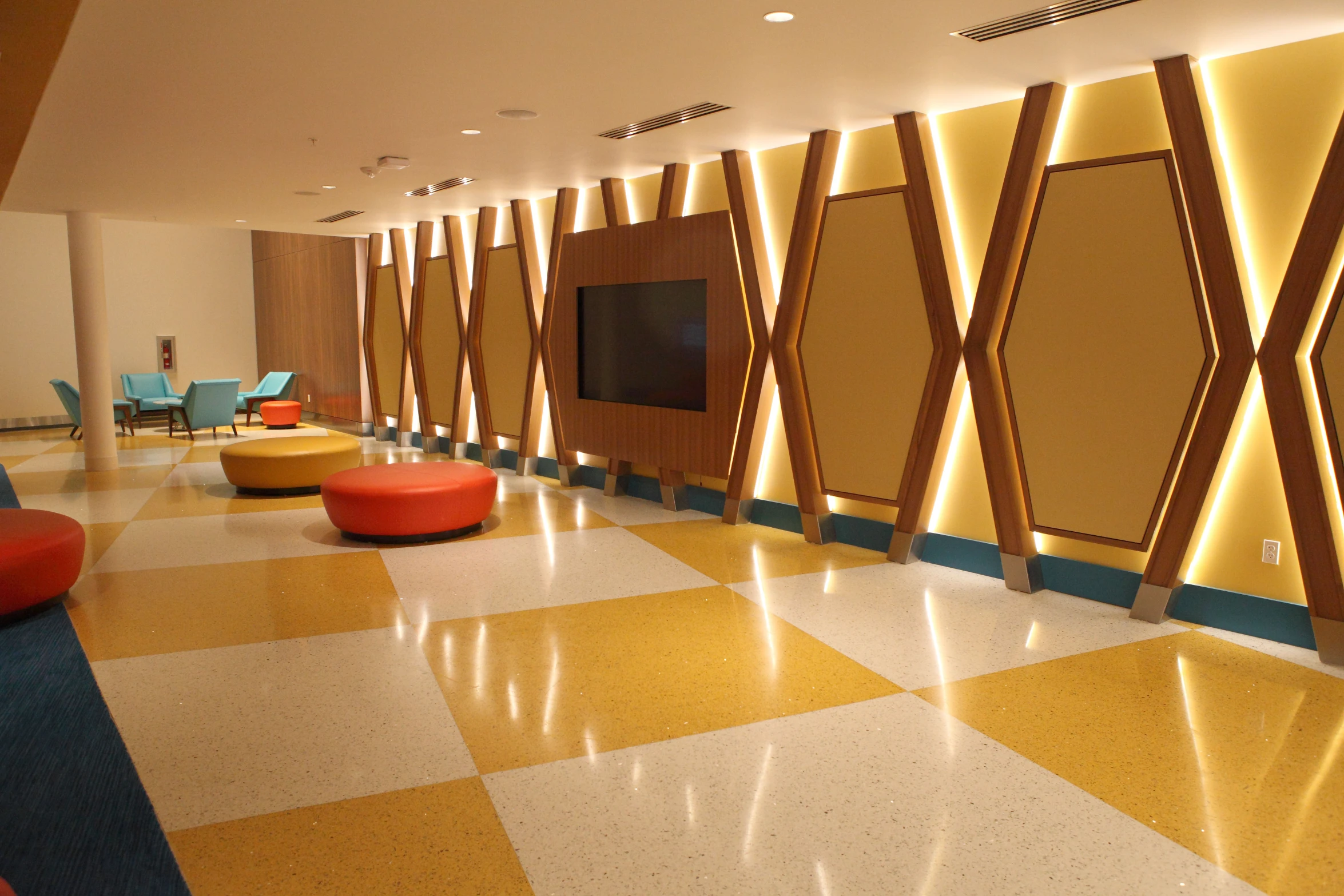 an office has a yellow and blue checkered floor