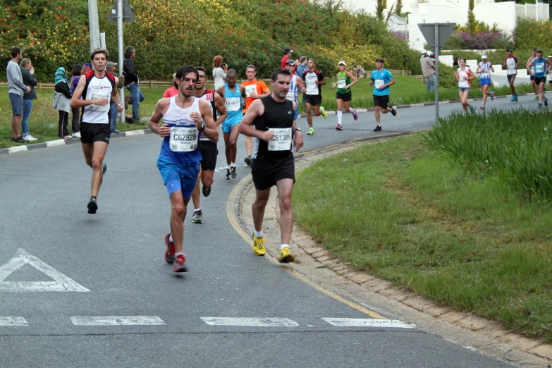 runners running in marathon wearing running apparel
