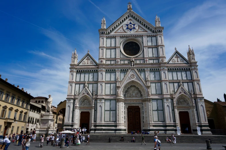 a tall church with a clock on the front