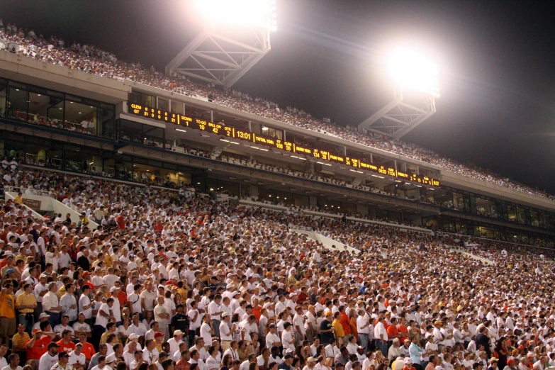 a very large crowd is on the stands in the stadium