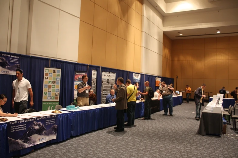 people at a display in a large room