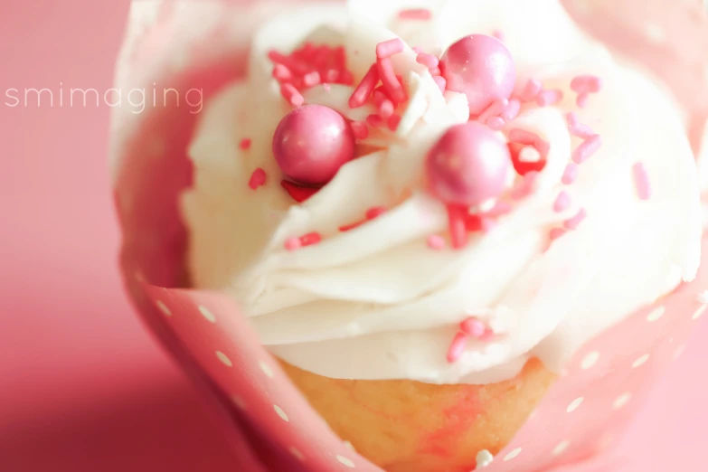 this cupcake has sprinkles and icing on top