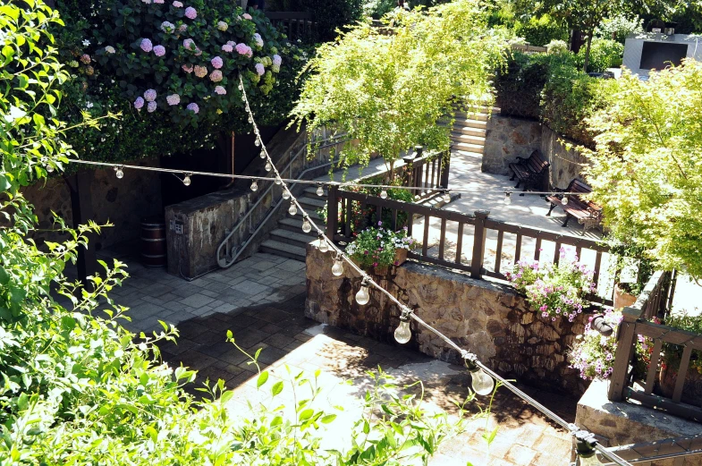 an aerial view of a garden and stairs