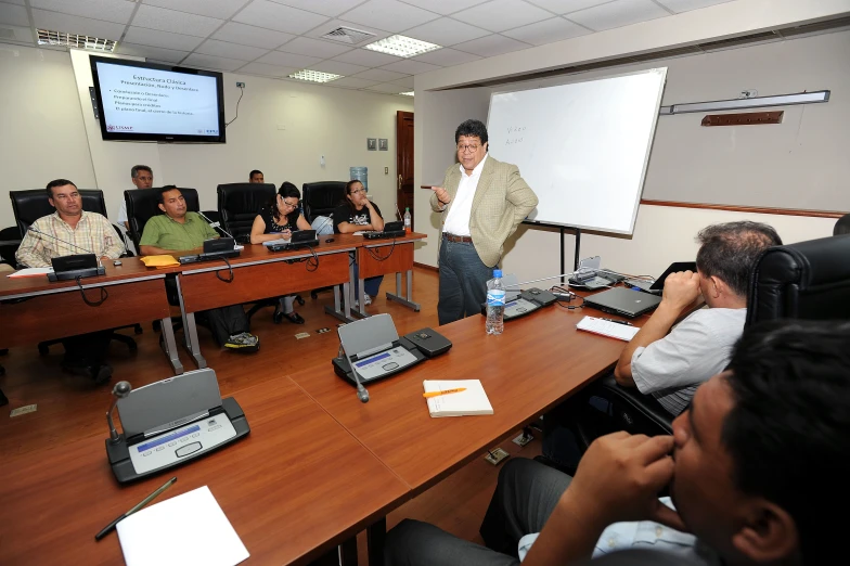 a man standing in front of a class room