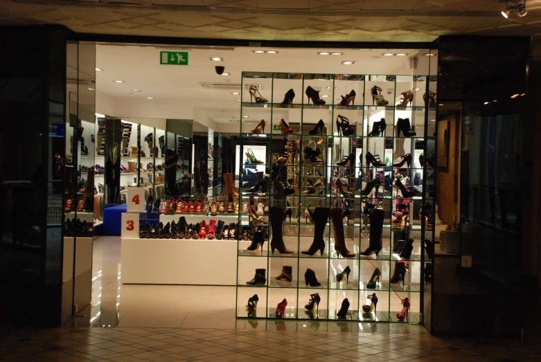 the store display is displaying several pairs of shoes