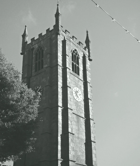 a tall clock tower sitting under a blue sky