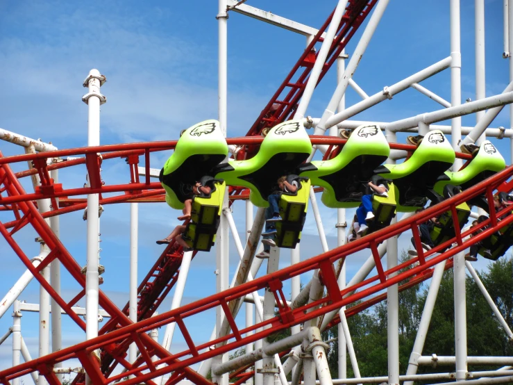 people are riding roller coasters and enjoying the ride