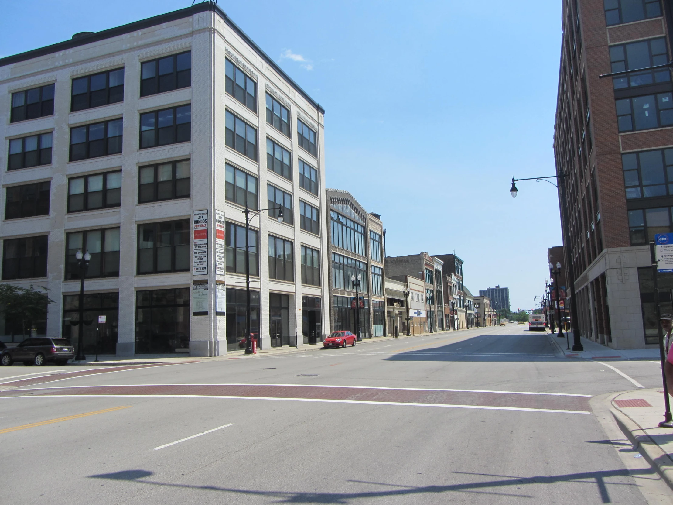 two streets and buildings on either side of the street