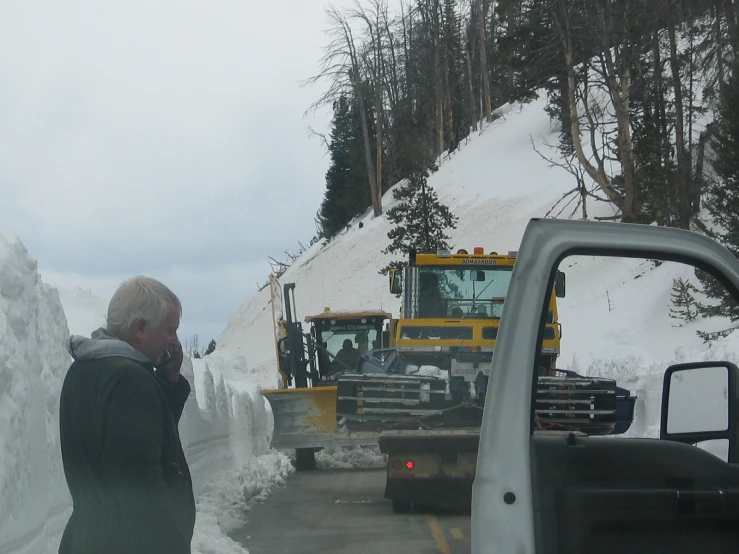 a big dump truck is parked by the side of the road